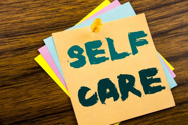 Hand writing text caption inspiration showing Self Care. Business concept for Taking caring for own Health written on sticky note paper on the wooden background. — Stock Photo, Image