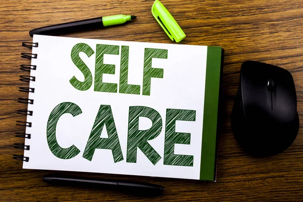 Handwriting Announcement text showing Self Care. Business concept for Taking caring for own Health written on notebook book note paper on the wooden background. Green word letters. Next to mouse. — Stock Photo, Image