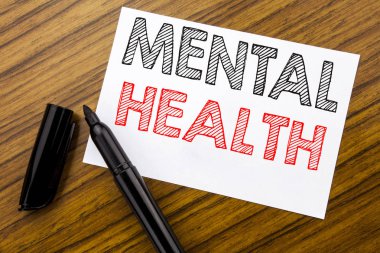 Ruh sağlığı gösterilen metin yazma. İş kavramı anksiyete hastalık ahşap arka plan üzerinde yapışkan not kağıdı kalemi ile yazılı bozukluğu için işaretleyici