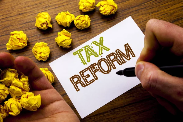 Word, writing Tax Reform. Concept for Government Change in Taxes written on notebook note paper on the wooden background with folded paper meaning thinking for idea. Man hand and marker. — Stock Photo, Image