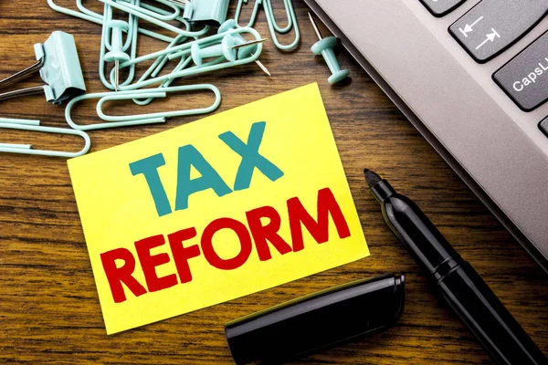 Handwriting Announcement text showing Tax Reform. Business concept for Government Change in Taxes written on sticky note paper on the wooden background next to the laptop keyboard With marker — Stock Photo, Image