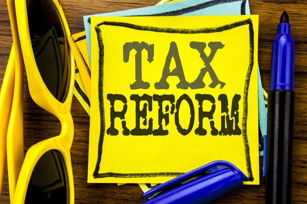 Hand writing text caption inspiration showing Tax Reform. Business concept for Government Change in Taxes Written on sticky note paper, wooden background with vacation sunglasses and bold marker — Stock Photo, Image