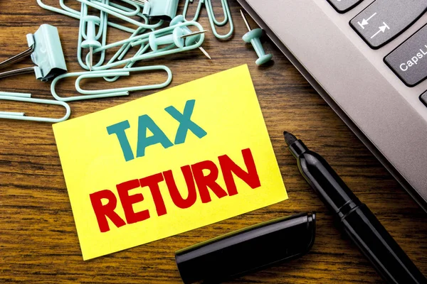 Handwriting Announcement text showing Tax Return. Business concept for Taxation Refund written on sticky note paper on the wooden background next to the laptop keyboard With marker — Stock Photo, Image