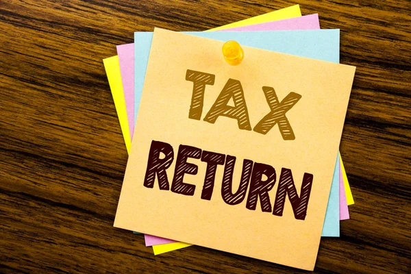 Conceptual hand writing text caption inspiration showing Tax Return. Business concept for Taxation Refund written on sticky note paper on the wooden background. — Stock Photo, Image