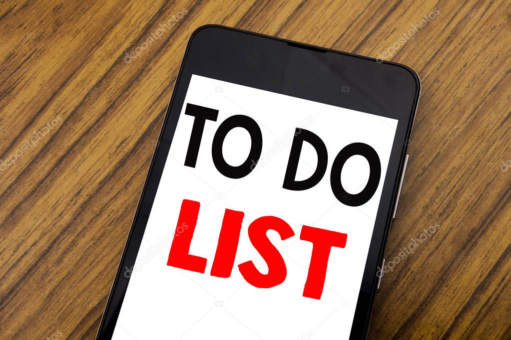 Word, writing handwriting To Do List. Business concept for Plan Lists Remider Written on mobile phone cellphone, wooden background with copy space.