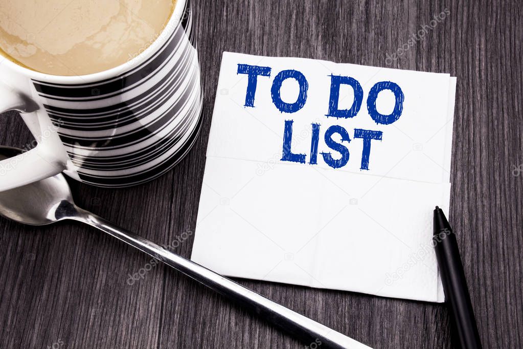 Handwritten text showing To Do List. Business concept for Plan Lists Remider written on the tissue paper handkerchief on the wooden wood background. With marker and coffee. Office top view.