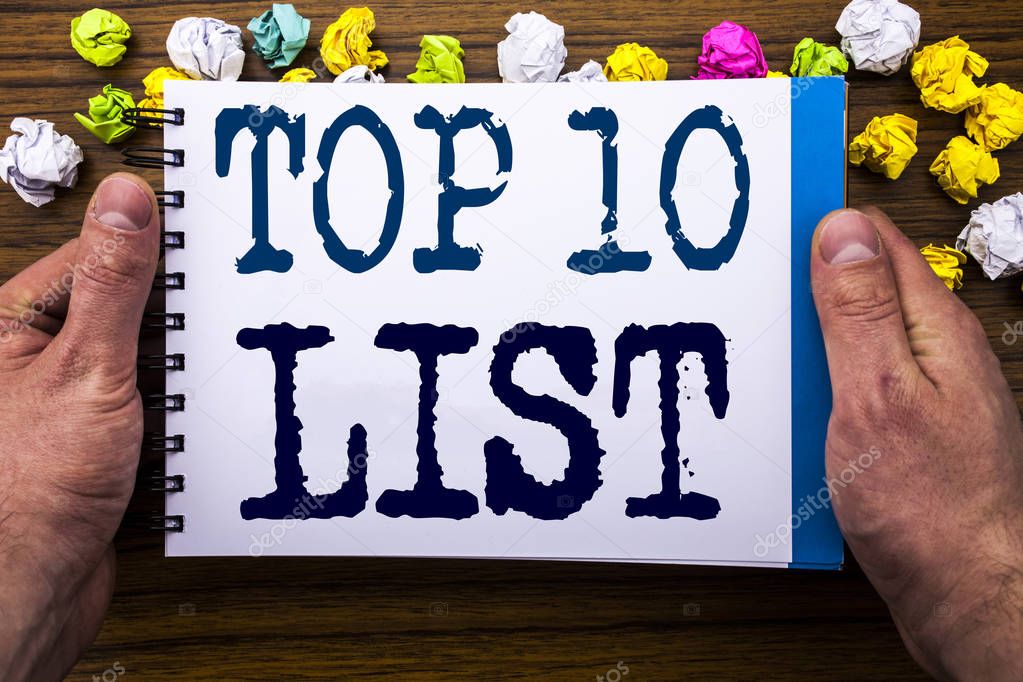 Writing text showing Top 10 Ten List. Business concept for Success ten list written on notepad notebook book on the wooden wood background with man businessman hand and finger.