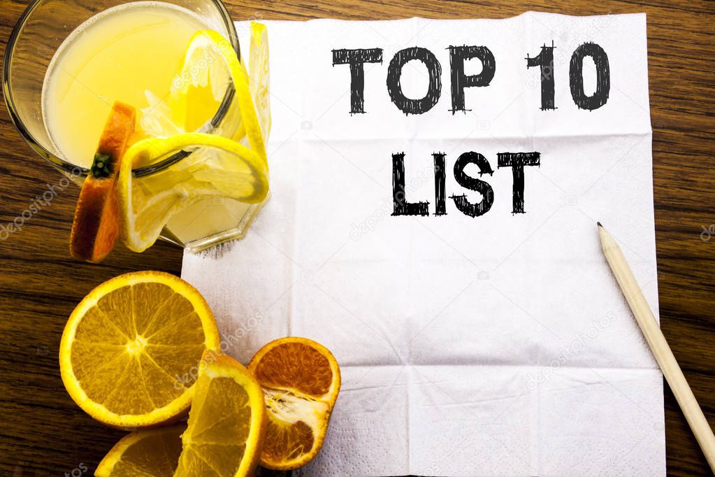 Conceptual text caption showing Top 10 Ten List. Concept for Success ten list written on tissue paper on the wooden background with pen healthy juice and orange fruit in the restaurant