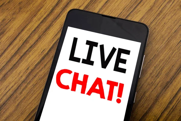 Word, writing handwriting Live Chat . Business concept for Communication Livechat Written on mobile phone cellphone, wooden background with copy space.
