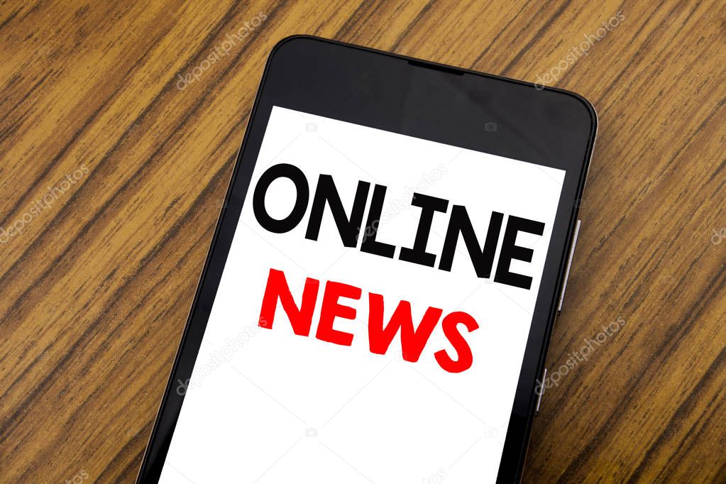 Word, writing handwriting Online News. Business concept for Online Newspaper Article Written on mobile phone cellphone, wooden background with copy space.