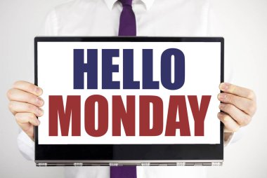 Word, Merhaba Pazartesi yazma. İş kavramı başlatmak gün hafta yazılı için tablet laptop adam tarafından holding arka plan bulanık. Bilgisayarı tutarak işadamı parmak.