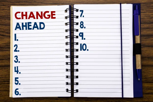 Writing text showing Change Ahead Red Word. Business concept for Future Changes Written on notebook note paper, wooden background with pen and marker. — Stock Photo, Image