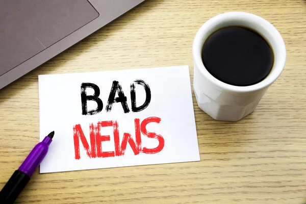 Handwriting Announcement text showing Bad News. Business concept for Failure Media Newspaper written on notebook book on the wooden background in the Office with laptop coffee Stock Image