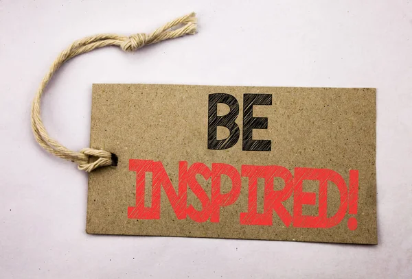 Hand writing text caption inspiration showing Be Inspired. Business concept for Inspiration, Motivation written on price tag paper on the white vintage background. — Stock Photo, Image