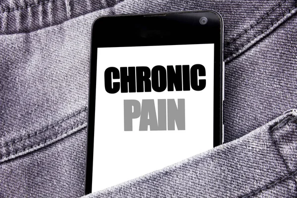 Hand writing text caption inspiration showing Chronic Pain. Business concept for Feeling Bad ill Care written mobile cell phone with copy space in the back pants trousers pocket