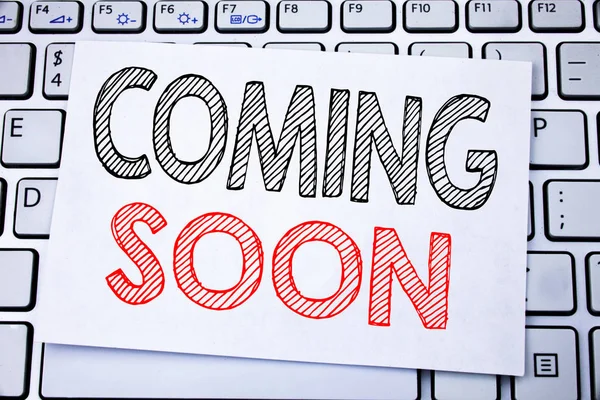 Handwritten text caption showing Coming Soon. Business concept writing for Under Construction written on sticky note paper on the white keyboard background. — Stock Photo, Image