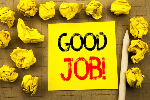 Good Job. Business concept for Success Appreciation written on sticky note paper on the vintage background. Folded yellow papers on the background