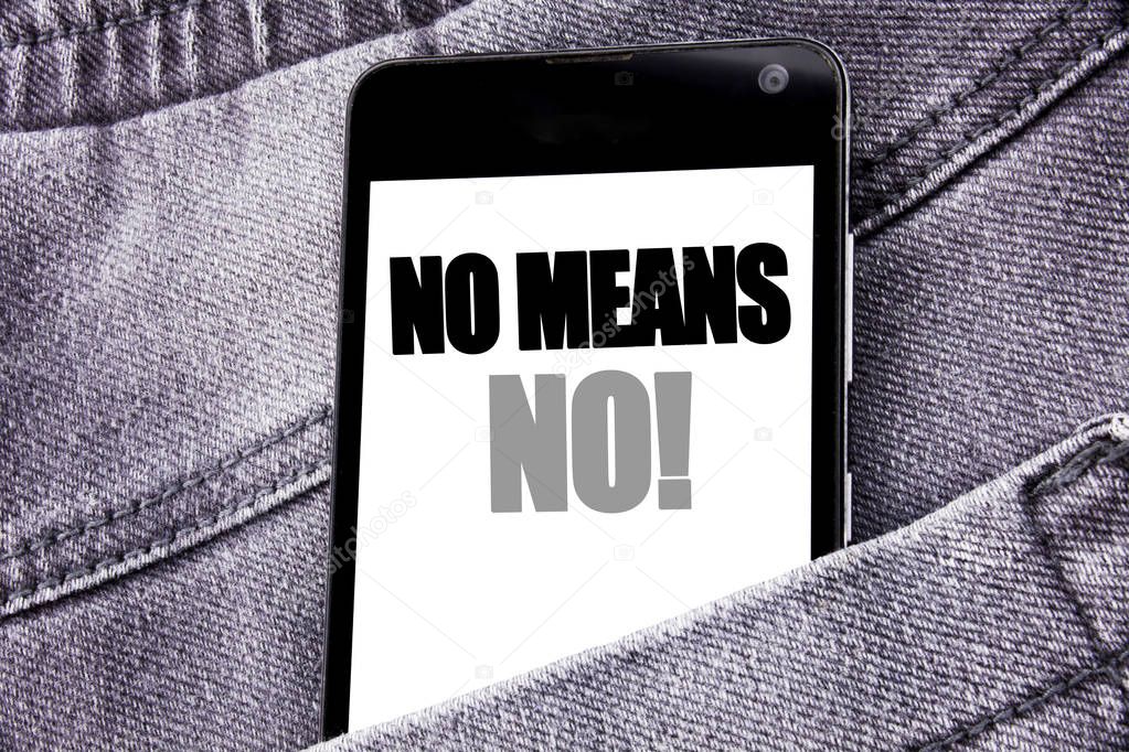 Hand writing text caption inspiration showing No Means No. Business concept for Stop Anti Rape Slogan written mobile cell phone with copy space in the back pants trousers pocket