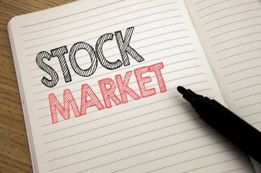 Borsa gösteren el yazısı duyuru metin. İş kavramı sermaye payı ile pen marker kitap arka plan üzerinde kopya alanı ile defter üzerinde yazılı değişimi için