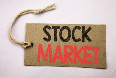 Borsa gösterilen metin resim yazısı ilham yazma el. İş kavramı sermaye payı beyaz vintage arka plan üzerinde fiyat etiketi kağıda yazılı değişimi için.