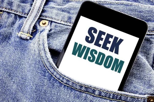 Conceptual hand writing text caption inspiration showing Seek Wisdom. Business concept for Inspiration Knowledge Written phone mobile phone, cellphone placed in the man front jeans pocket.