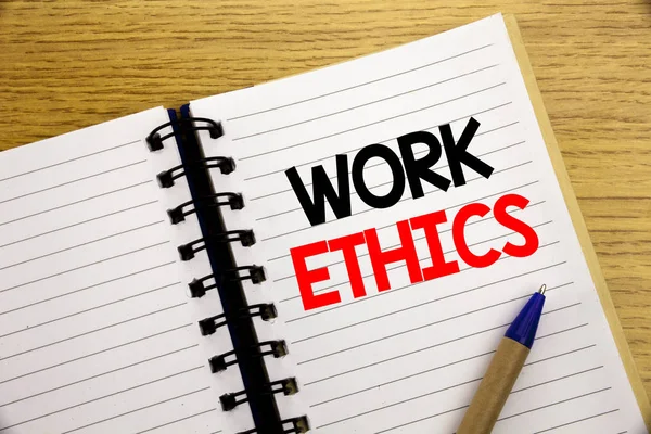 Word, writing Work Ethics. Business concept for Moral Benefit Principles written on notepad with copy space on old wood wooden background with pen marker