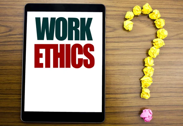 Word, writing Work Ethics. Business concept for Moral Benefit Principles Written on tablet, wooden background with question mark on the end.