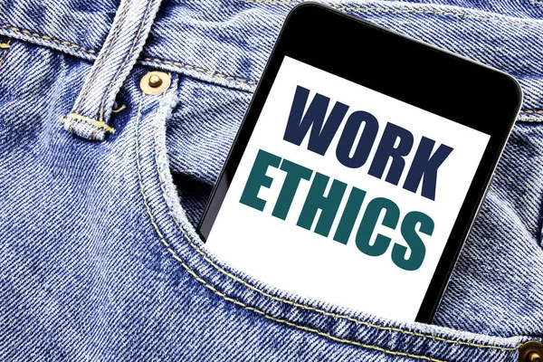 Conceptual hand writing text caption inspiration showing Work Ethics. Business concept for Moral Benefit Principles Written phone mobile phone, cellphone placed in the man front jeans pocket.