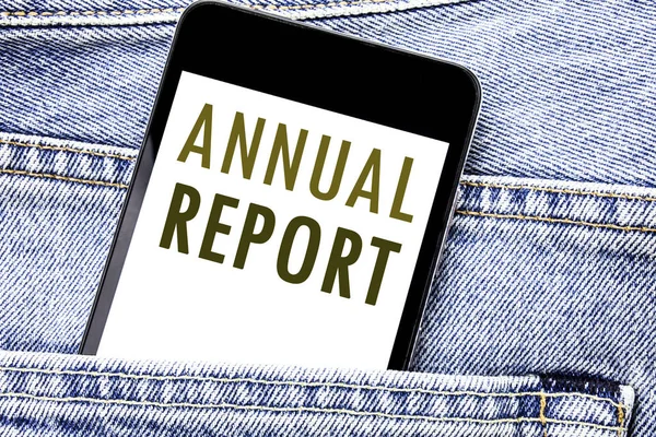 Handwriting Announcement text showing Annual Report. Business concept for Analyzing Performance  Written phone mobile phone, cellphone placed in the man front jeans pocket. — Stock Photo, Image