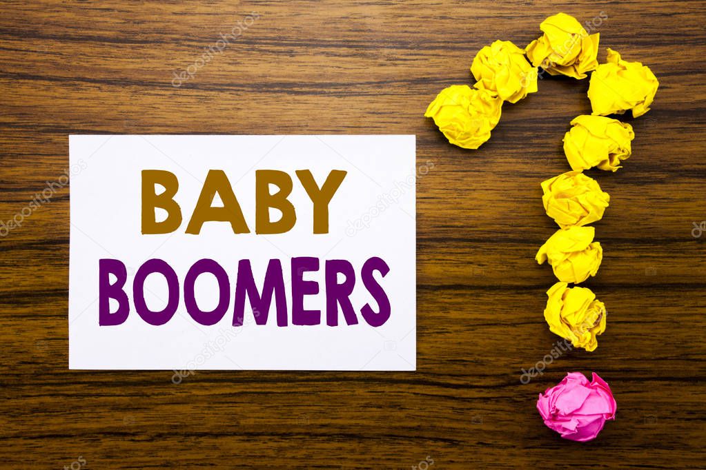 Handwritten text showing Baby Boomers. Business concept for Demographic Generation Written on sticky note paper, wooden background with question mark from sticky note. For asking questions.