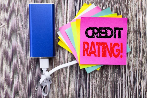 Credit Rating. Business concept for Finance Score History written on sticky note with copy space on old wood wooden background with power bank