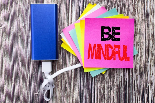 Be Mindful. Business concept for Mindfulness Healthy Spirit written on sticky note with copy space on old wood wooden background with power bank