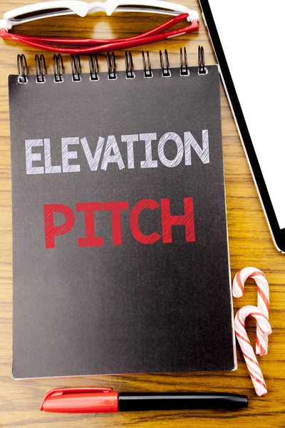 Word, writing Elevation Pitch. Business concept for Talking Communication Written on the notebook book, wooden background with sticky sunglasses and red pen