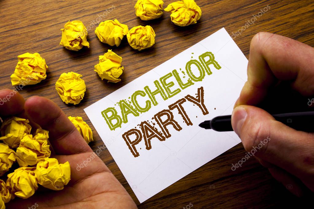 Word, writing Bachelor Party. Concept for Stag Fun Celebrate written on notebook note paper on the wooden background with folded paper meaning thinking for idea. Man hand and marker.