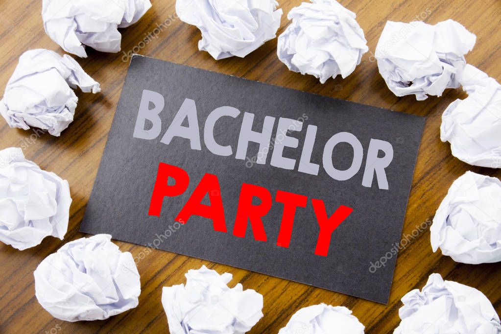 Hand writing text caption showing Bachelor Party. Business concept for Stag Fun Celebrate written on sticky note paper on the wooden background with folded paper meaning thinking