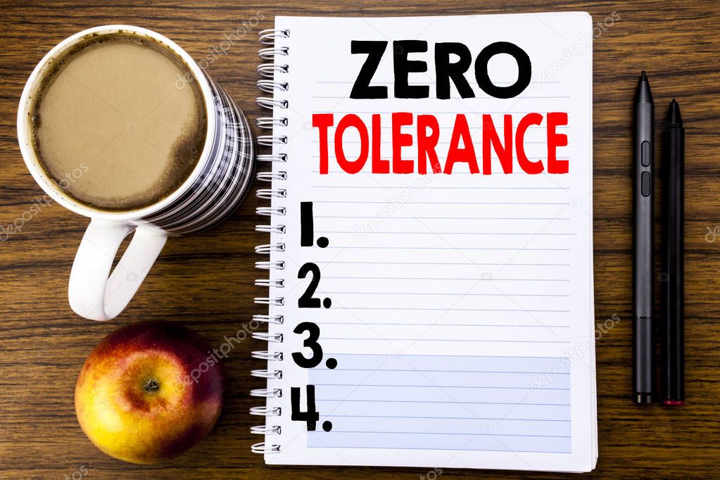 Handwritten text showing Zero Tolerance. Business concept for Policy For Punishment written on notepad note paper on the wood structure background background.