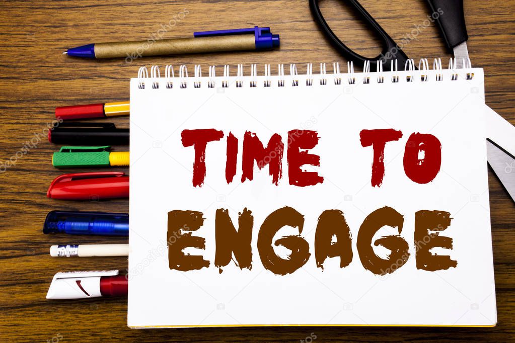 Word, writing Time To Engage. Business concept for Engagement Involvement Written on notebook, wooden background with office equipment like pens scissors colourful marker  