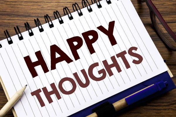 Hand writing text caption inspiration showing Happy Thoughts. Business concept for Happiness Thinking Good Written on notebook note paper, wooden background with glasses pen and marker. — Stock Photo, Image