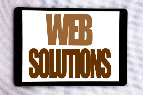 Вдохновение для написания текста под заголовком "Web Solutions". Бизнес-концепция плана интернет-дизайна написана на экране планшета на белом фоне . — стоковое фото