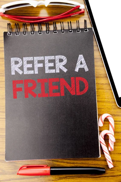 Word, writing Refer A Friend. Business concept for Referral Marketing Written on the notebook book, wooden background with sticky sunglasses and red pen — Stock Photo, Image