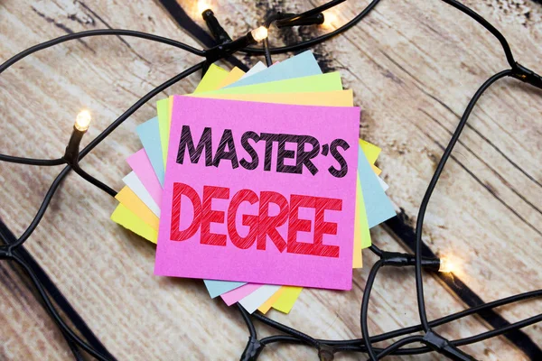 Handwriting Announcement text showing Master s Degree. Business concept for Academic Education written on sticky note with copy space on the wooden vintage background — Stock Photo, Image