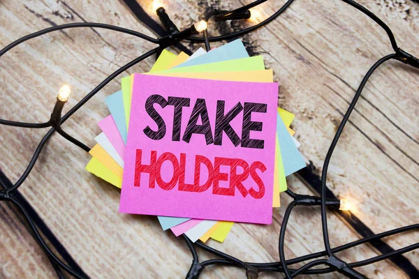 Handwriting Announcement text showing Stake Holders. Business concept for Stakeholder Engagement written on sticky note with copy space on the wooden vintage background — Stock Photo, Image