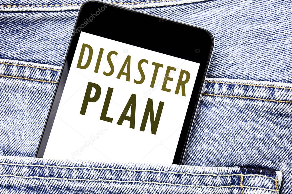 Handwriting Announcement text showing Disaster Plan. Business concept for Emergency Recovery Written phone mobile phone, cellphone placed in the man front jeans pocket.