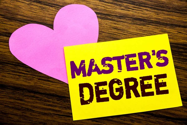 Hand writing text caption inspiration showing Master s Degree. Business concept for Academic Education written on sticky note paper, wooden wood background. With pink heart meaning love adoration. — Stock Photo, Image