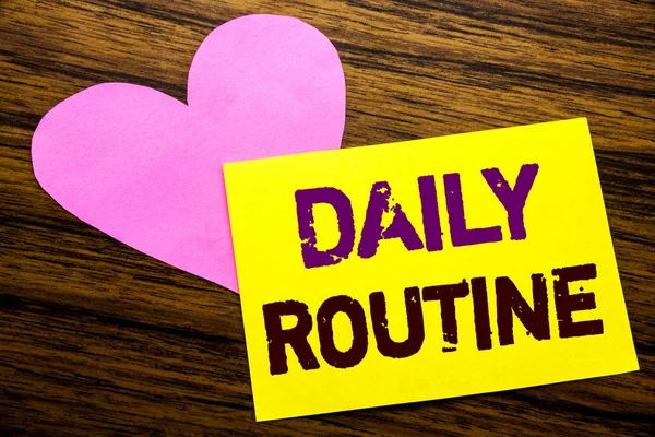 Hand writing text caption inspiration showing Daily Routine. Business concept for Habitual Lifestyle written on sticky note paper, wooden wood background. With pink heart meaning love adoration. — Stock Photo, Image