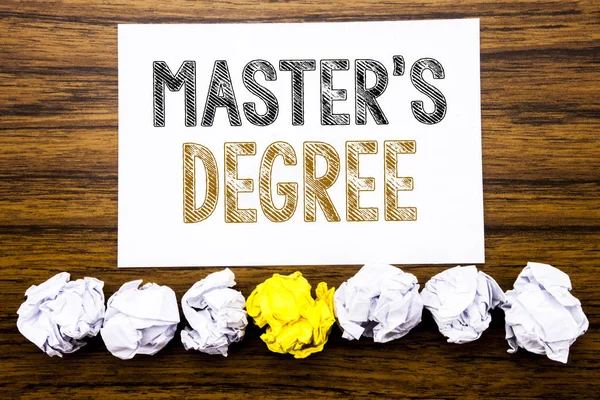 Word, writing Master s Degree. Concept for Academic Education Written on sticky note paper reminder, wooden background with sticky, one folded paper alone for difference or collaboration