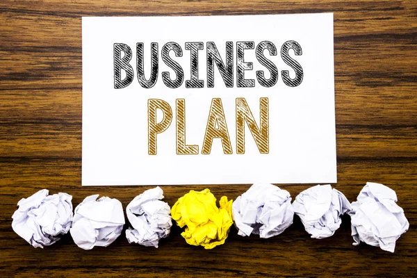 Word, writing Business Plan. Concept for Mission or Vision Written on sticky note paper reminder, wooden background with sticky, one folded paper alone for difference or collaboration — Stock Photo, Image