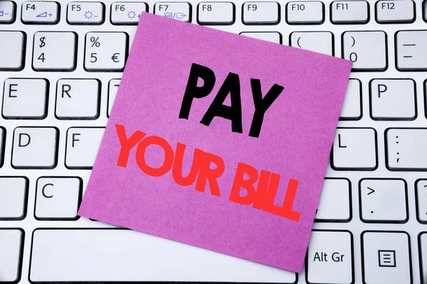 Handwriting Announcement text showing Pay Your Bill. Business concept for Payment for Goverment written on sticky note paper on the white keyboard background. — Stock Photo, Image