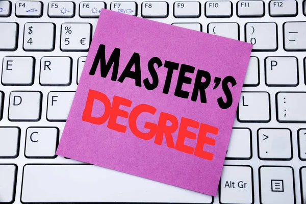 Handwriting Announcement text showing Master s Degree. Business concept for Academic Education written on sticky note paper on the white keyboard background. — Stock Photo, Image