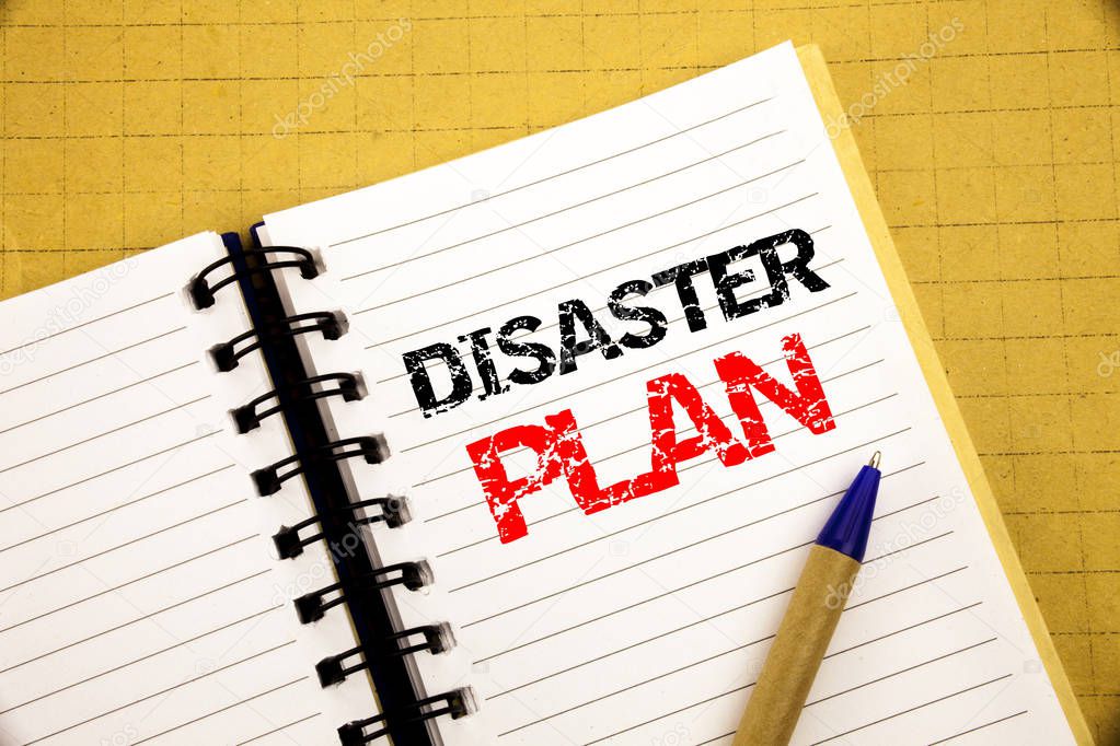 Disaster Plan. Business concept for Emergency Recovery written on notepad with copy space on old wood wooden background with pen marker